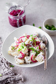 Potato salad with pickled cucumber, red onion, apple, and spring onion