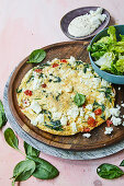 Omelette with feta cheese, spinach and tomatoes