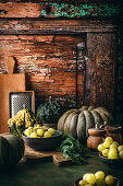 Autumn still life with pumpkins and grapes