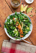 Roasted salmon on avocado-arugula-asparagus salad