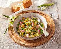 Spring potato salad with wild garlic peas and radish