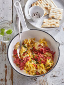 Matzo porridge with salami and onions