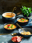 Creamy tomato soup with prosciutto and croutons
