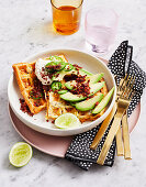 Loaded cheesy waffles with avocado and bacon crumble