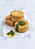 Cheesy crisp polenta cakes with coriander and ginger sauce