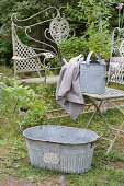 Zinc tub and zinc watering can in the garden