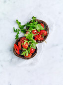 Roast mushrooms with tomato, chilli and rocket