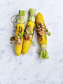 Barbecued corn cobs with sesame and hoisin butter