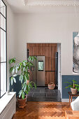 View from dining room of customized kitchen with wooden front cabinets