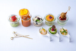 Various starters in glasses and spoon bites