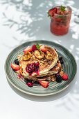 Breakfast pancakes with berries and grilled banana