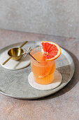 Grapefruit spritz made with Cointreau, lime juice, grapefruit juice and prosecco