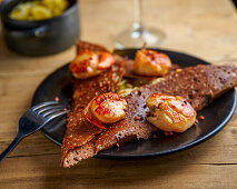 Galette with cheese sauce and fried scallops