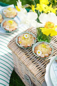 Muffins with pistachios and edible flowers (primroses and daisies)