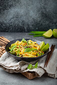 Vegetarian noodles with vegetables and lime (Asia)