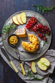 British pork pie with grainy mustard, apple slices and red grapes