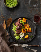 Saddle of hare with broad bean mash and pumpkin polenta