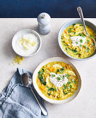 Spiced red lentil and chicken soup with greens