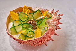 Cucumber with caviar in a spider crab shell