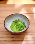 Pea risotto with herb garnish