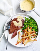 Beef with peas, fries and bearnaise sauce
