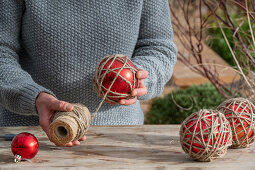 Wrap balls with garden twine