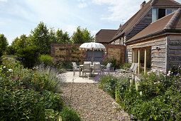 Outdoor dining area with table, chairs and table umbrella