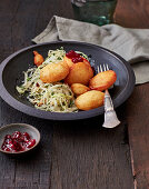 Cheese dumplings with cabbage salad (Switzerland)