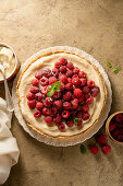 Tart with lemon curd and raspberries