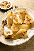Roasted pears with walnuts and ginger syrup