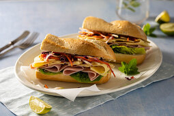 Baguette sandwich with ham, cheese, and vegetables