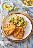 Breaded horseradish-mustard pork cutlets with potatoes