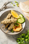 Marinated chicken skewers with mashed potatoes