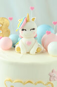 Unicorn cake with sculpted fondant unicorns