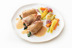 Veal rolls with pears, chard, and mortadella