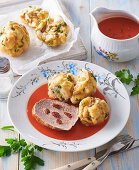 Roast beef with dumplings and tomato sauce