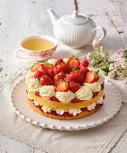 Strawberry sponge cake and whipped cream and fresh strawberries