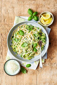 Linguine with lemons, zucchini, peas, and parmesan cheese
