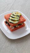 Watermelon sandwich with cucumber, olives, and feta
