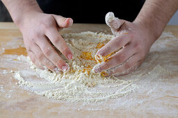 Making pasta dough: Mixing the egg with the flour