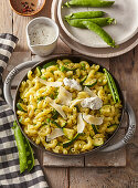 Elbow pasta with zucchini, peas and herb yogurt