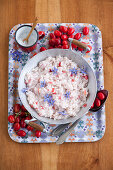 Rice porridge with cornelian cherries and borage flowers