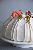 Volcano pavlova with strawberries and passion fruit