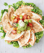 Quesadillas with pulled chicken and avocado cream