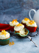 Poppy seed muffins with orange frosting