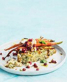 Persian rice tart with pomegranate, feta and herbs