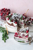 Cranberry crêpe cake with whipped cream and rosemary