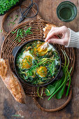 Fried eggs with wild garlic