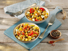 Colorful lentil salad with apple, peppers, cucumber and feta