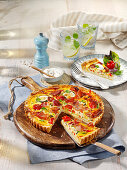 French vegetable quiche with peppers, zucchini and bacon